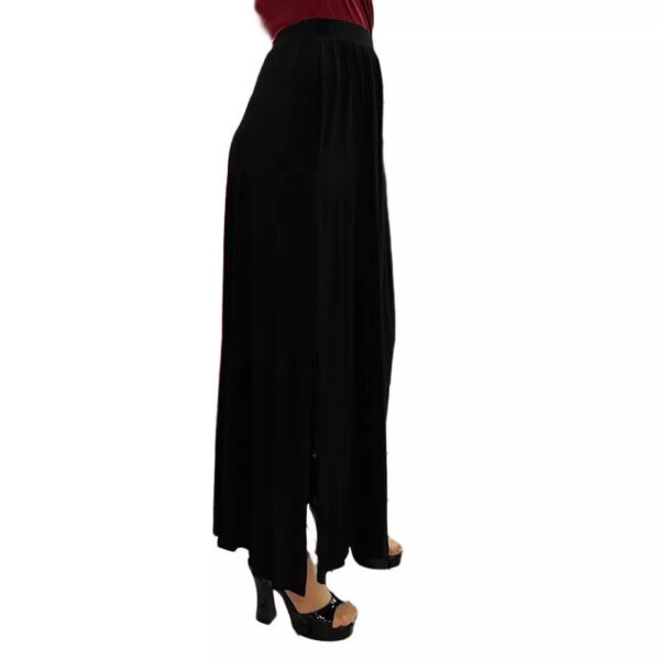 A waist down model wearing a long maxi skirt and open toe sandals.